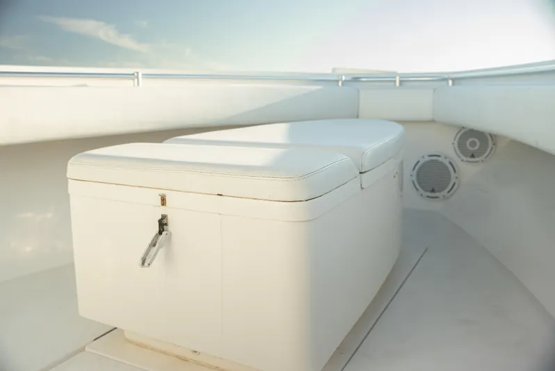  Yacht Photos Pics 2015 Contender 32 ST boat interior with cushioned seating and storage.