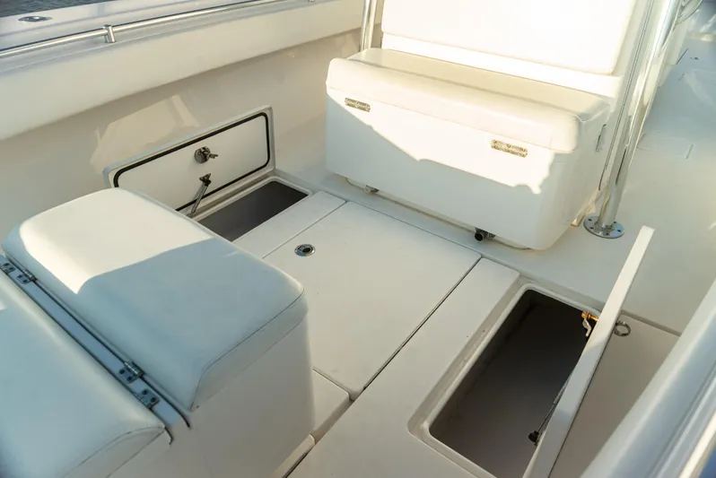  Yacht Photos Pics 2015 Contender 32 ST boat interior with storage compartments and seating.
