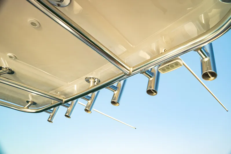  Yacht Photos Pics 2015 Contender 32 ST boat with rod holders against clear sky.