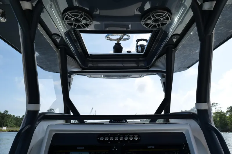 Warranty X Trailer Yacht Photos Pics 2022 Yellowfin 34 Offshore boat interior with modern controls and speakers.