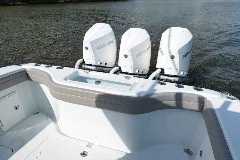 Warranty X Trailer Yacht Photos Pics 2022 Yellowfin 34 Offshore boat with triple Mercury outboard engines on water.