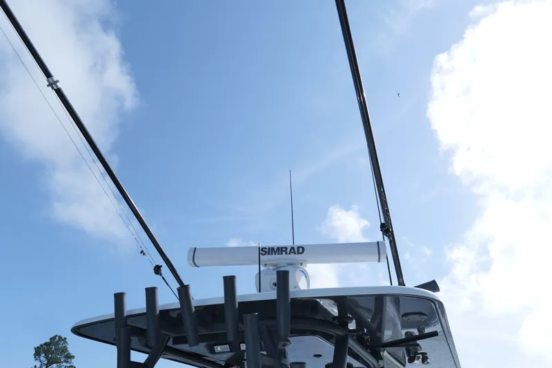 Warranty X Trailer Yacht Photos Pics 2022 Yellowfin 34 Offshore boat with Simrad radar against a clear blue sky.