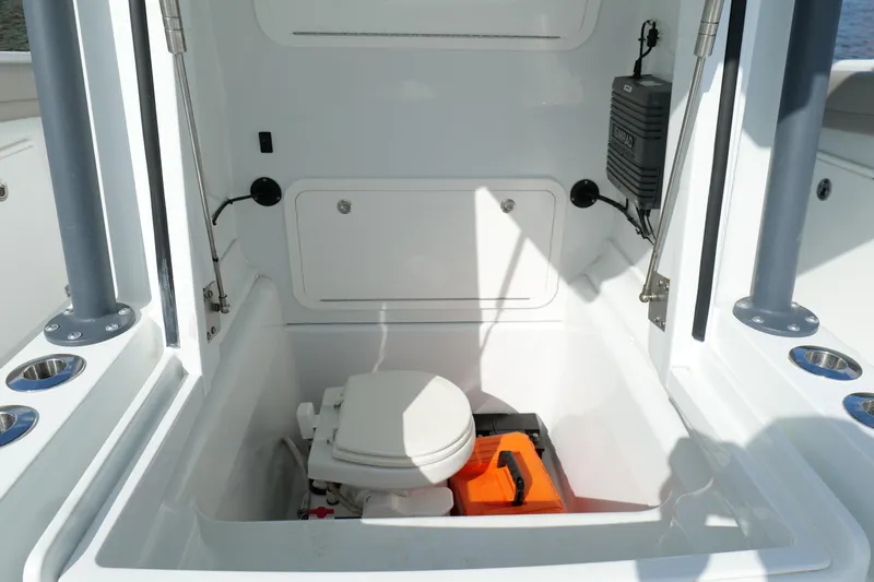 Warranty X Trailer Yacht Photos Pics 2022 Yellowfin 34 Offshore boat interior with marine toilet and storage compartment.