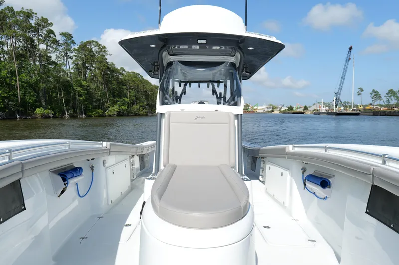 Warranty X Trailer Yacht Photos Pics 2022 Yellowfin 34 Offshore boat on calm water, featuring spacious deck and modern design.
