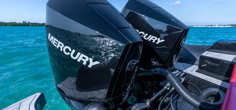 Yacht Photos Pics Twin Mercury outboard engines on a Novielli Veloche 349, 2025 model, in clear blue waters.