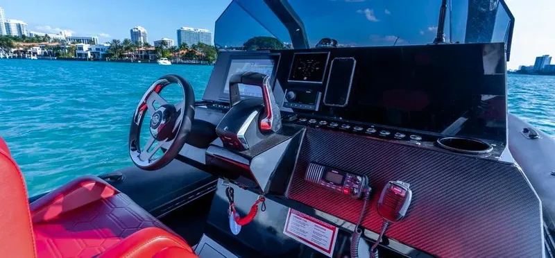  Yacht Photos Pics Cockpit of 2025 Novielli Veloche 349 boat with modern controls and red seating.