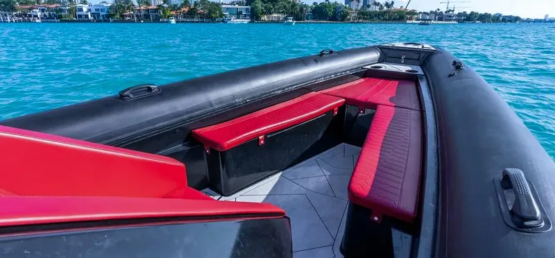  Yacht Photos Pics 2025 Novielli Veloche 349 boat with red seating, cruising on blue water.