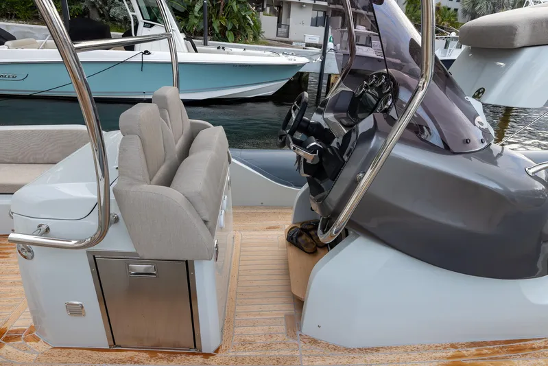  Yacht Photos Pics 2024 SACS Strider 900 boat interior with modern seating and steering console.
