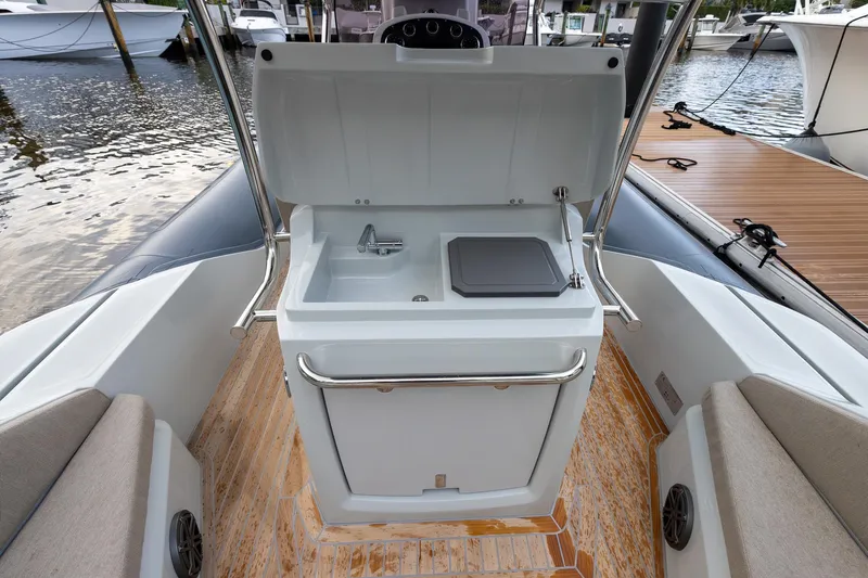  Yacht Photos Pics 2024 SACS Strider 900 boat interior with sink and seating area.