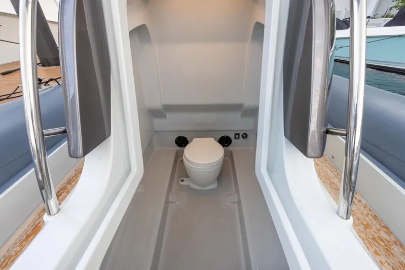  Yacht Photos Pics 2024 SACS Strider 900 boat interior with modern toilet facilities.