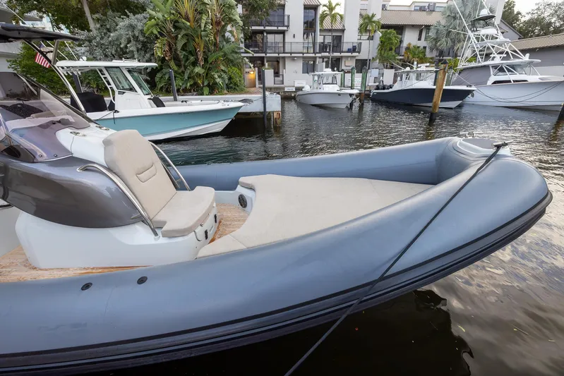  Yacht Photos Pics 2024 SACS Strider 900 boat docked in a marina, featuring sleek design and modern amenities.