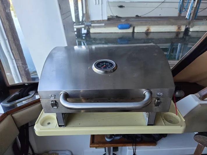 Steel Leader Yacht Photos Pics Stainless steel grill on 1990 Bayliner 4588 Motoryacht, docked with water view.