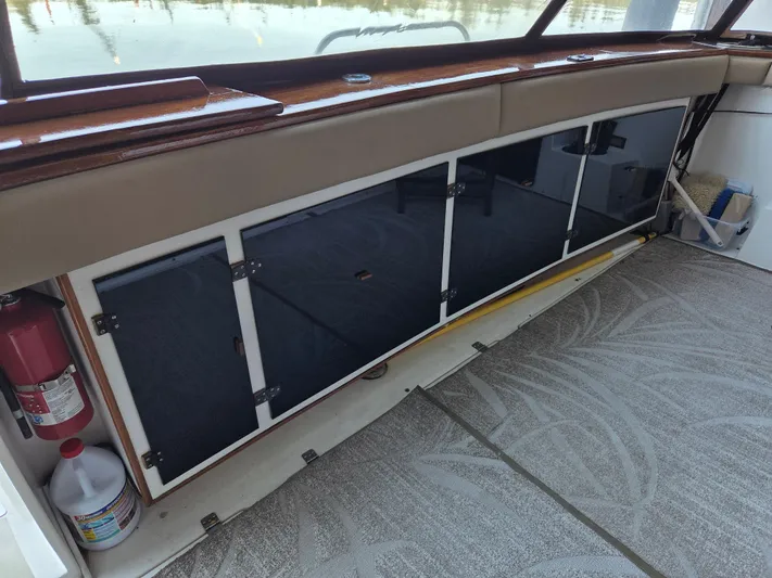 Steel Leader Yacht Photos Pics 1990 Bayliner 4588 Motoryacht interior with storage cabinets and safety equipment.