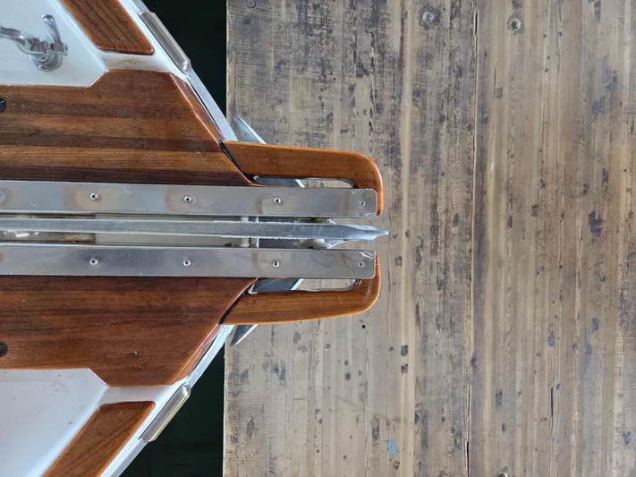 Steel Leader Yacht Photos Pics Bow of 1990 Bayliner 4588 Motoryacht with wooden deck and metal fittings.