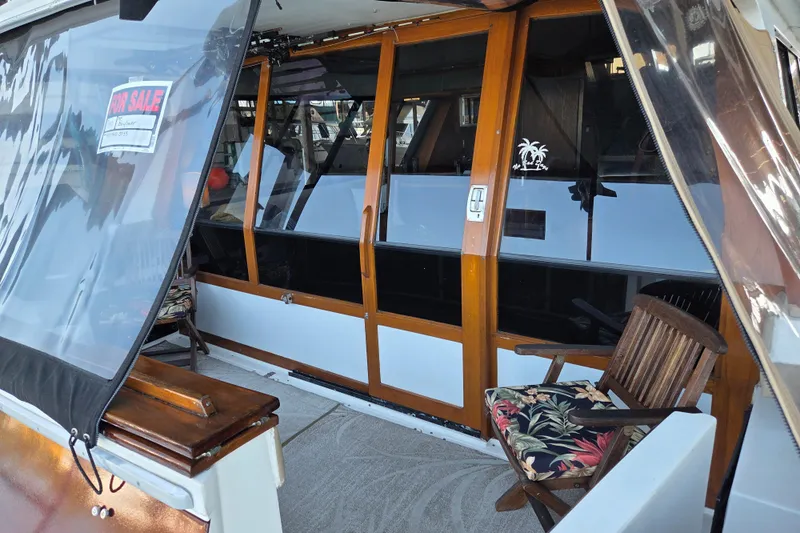 Steel Leader Yacht Photos Pics 1990 Bayliner 4588 Motoryacht for sale, featuring wooden doors and outdoor seating.