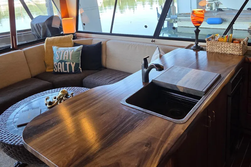 Steel Leader Yacht Photos Pics Luxurious interior of 1990 Bayliner 4588 Motoryacht with cozy seating and stylish decor.