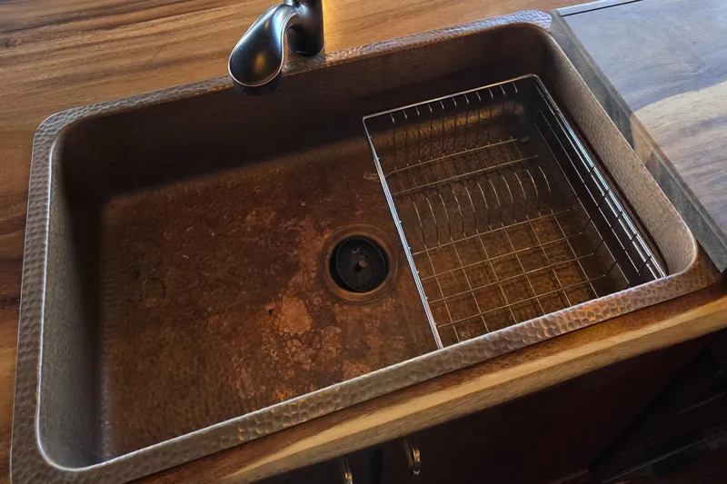 Steel Leader Yacht Photos Pics Copper sink with faucet and drying rack on Bayliner 4588 Motoryacht, 1990 model.