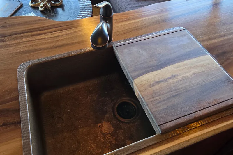 Steel Leader Yacht Photos Pics Wooden countertop with integrated sink and faucet on a 1990 Bayliner 4588 Motoryacht.