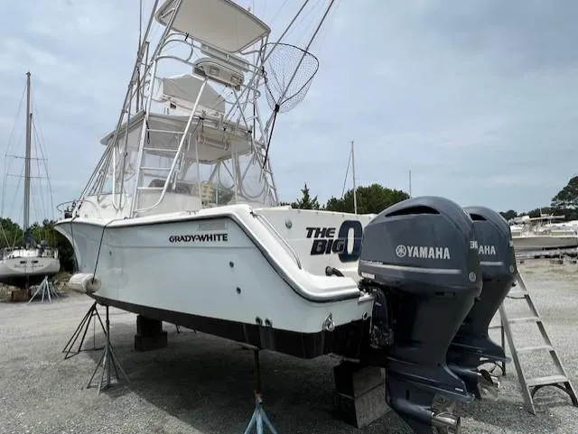 The Big O Yacht Photos Pics 2002 Grady-White 330 Express boat with Yamaha engines on dry dock.