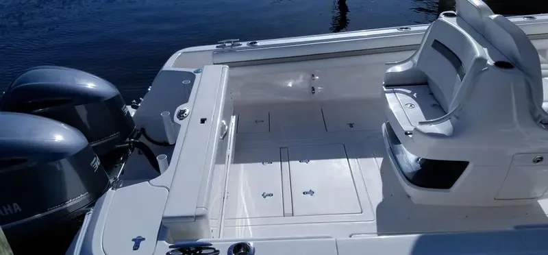  Yacht Photos Pics 2016 Intrepid 327 Center Console boat with dual Yamaha engines, docked on calm water.