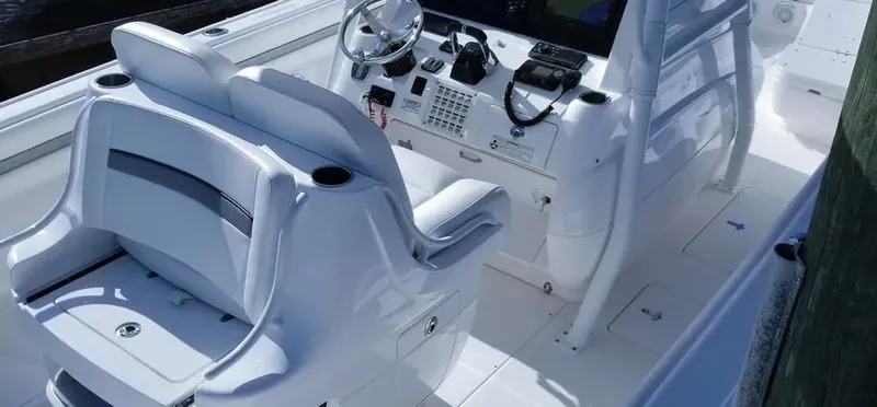  Yacht Photos Pics 2016 Intrepid 327 Center Console boat interior with dual seating and control panel.