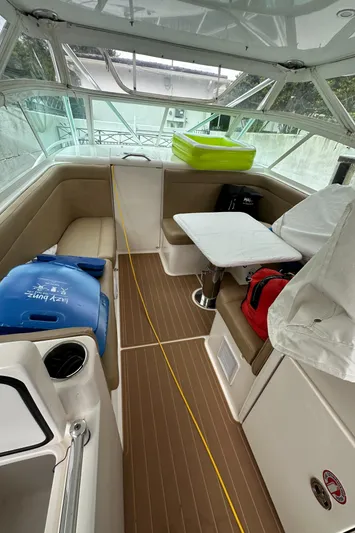 Maripal Yacht Photos Pics 2008 Contender 38 Express boat interior with seating, table, and storage.