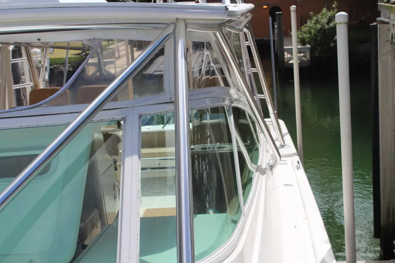 Maripal Yacht Photos Pics 2008 Contender 38 Express boat docked, showcasing sleek design and glass windows.