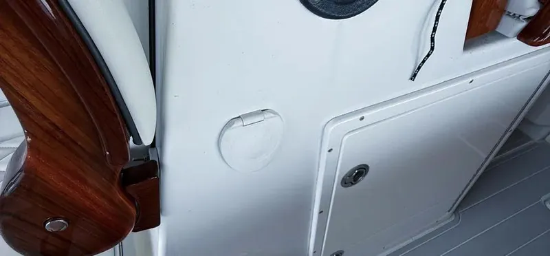  Yacht Photos Pics Interior detail of a 2019 Freeman 42 LR boat, featuring wood accents and storage compartments.
