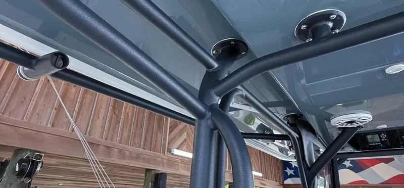  Yacht Photos Pics 2019 Freeman 42 LR boat canopy structure with mounted speakers and flag in background.