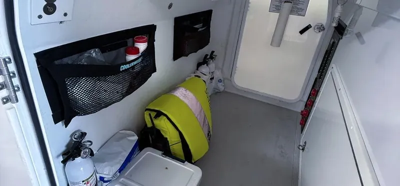  Yacht Photos Pics Interior of a 2019 Freeman 42 LR boat with storage compartments and safety equipment.