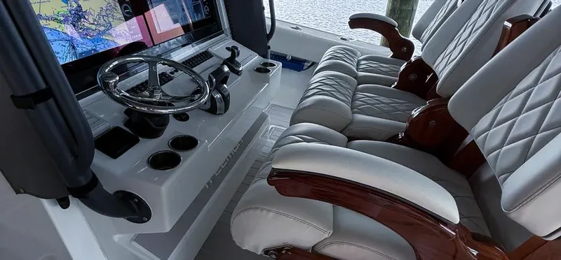  Yacht Photos Pics Luxurious interior of 2019 Freeman 42 LR boat with leather seats and navigation system.