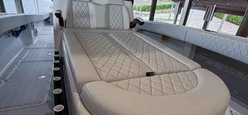  Yacht Photos Pics Luxurious interior of a 2019 Freeman 42 LR boat with quilted seating.