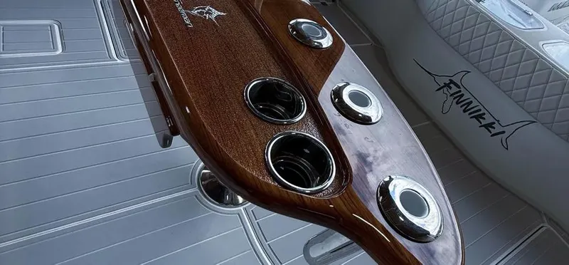  Yacht Photos Pics Luxurious interior of 2019 Freeman 42 LR boat with polished wood and cup holders.