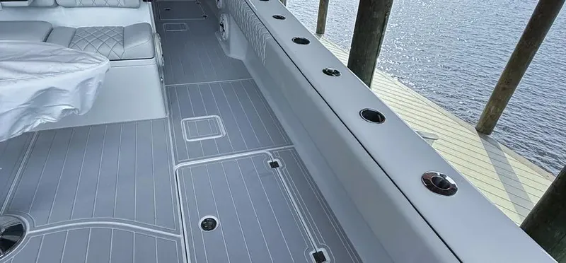  Yacht Photos Pics 2019 Freeman 42 LR boat interior with sleek gray flooring and seating by the water.