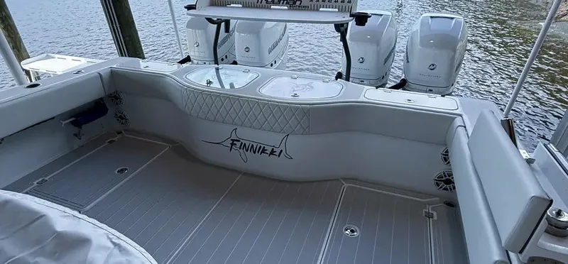  Yacht Photos Pics Freeman 42 LR 2019 boat deck with seating and outboard motors by the water.