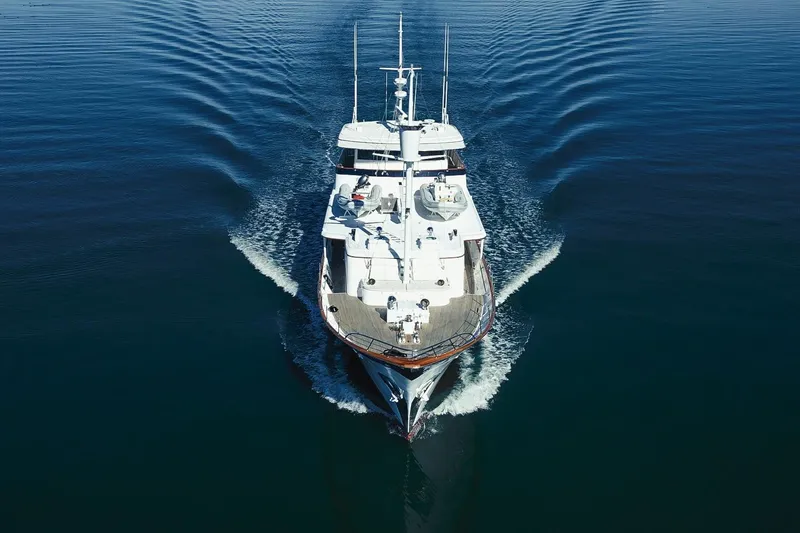 Nordic Star Yacht Photos Pics Aerial view of 1969 Lantana Custom yacht cruising on calm blue waters.