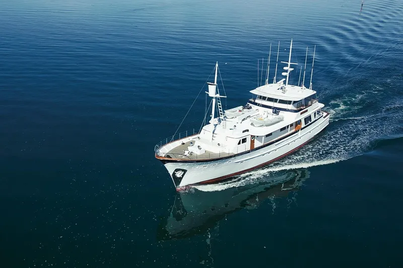 Nordic Star Yacht Photos Pics Aerial view of 1969 Lantana Custom yacht cruising on calm blue waters.