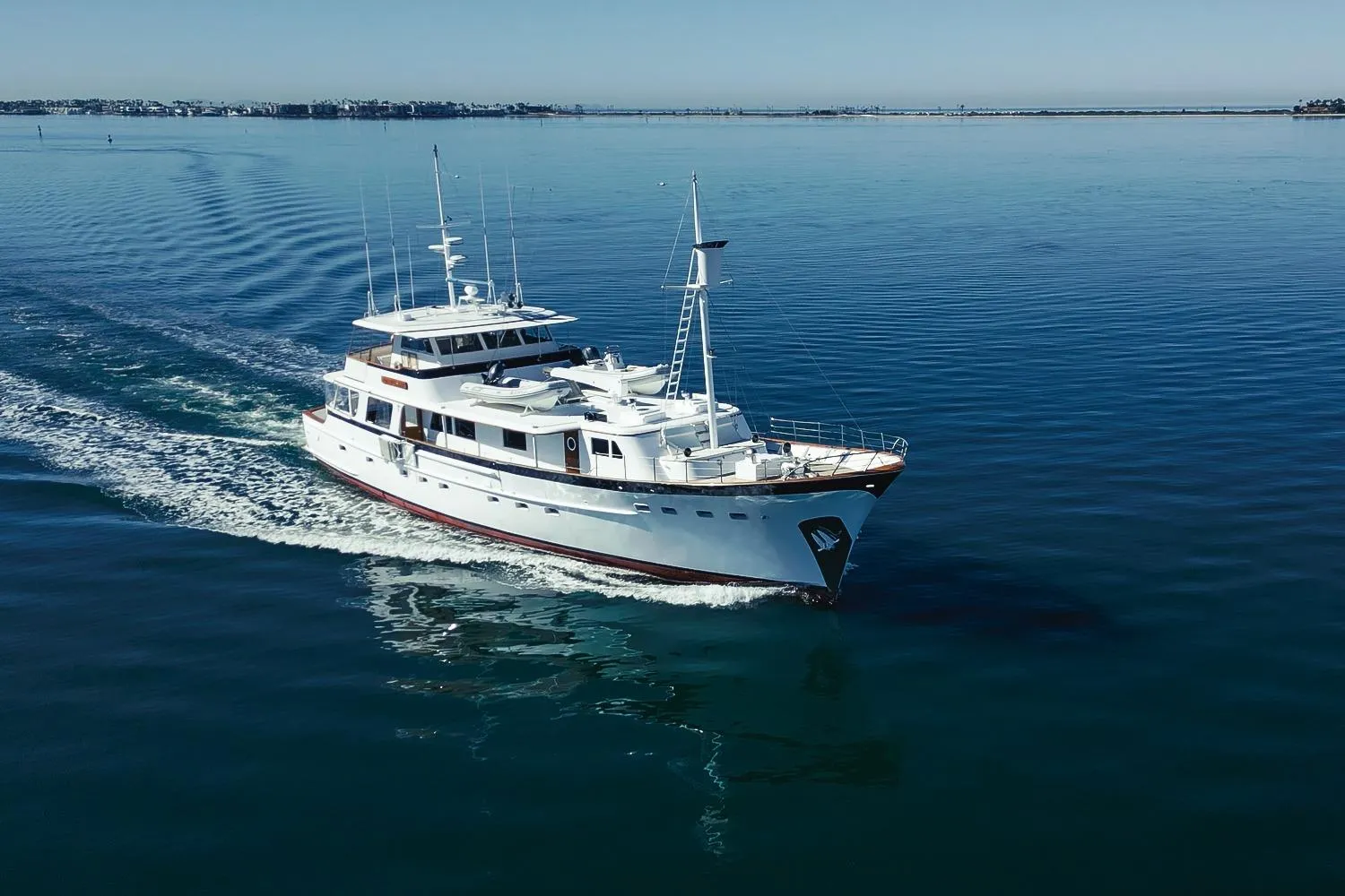 Vintage 1969 Lantana Custom yacht cruising on calm blue waters.