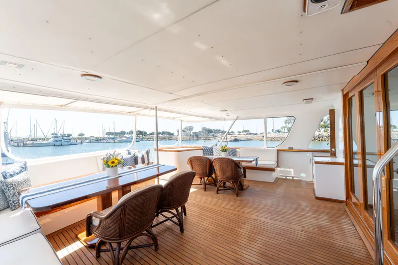 Nordic Star Yacht Photos Pics Luxurious 1969 Lantana Custom yacht interior with elegant seating and scenic marina view.