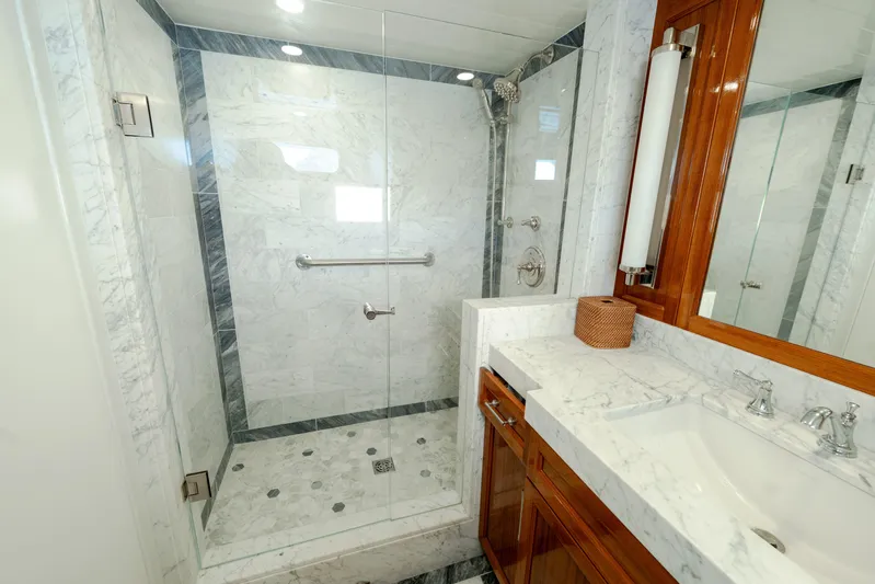 Nordic Star Yacht Photos Pics Luxurious marble bathroom with glass shower in 1969 Lantana Custom model.