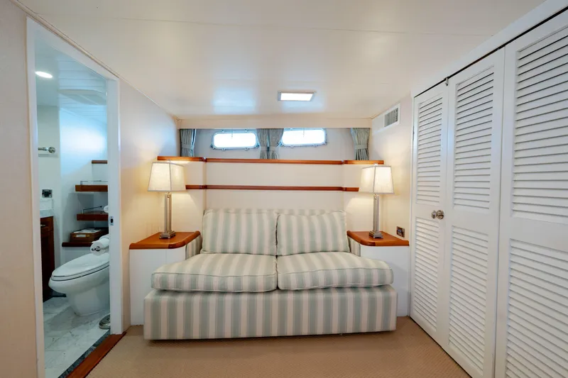 Nordic Star Yacht Photos Pics Cozy 1969 Lantana Custom yacht interior with striped sofa, lamps, and bathroom.