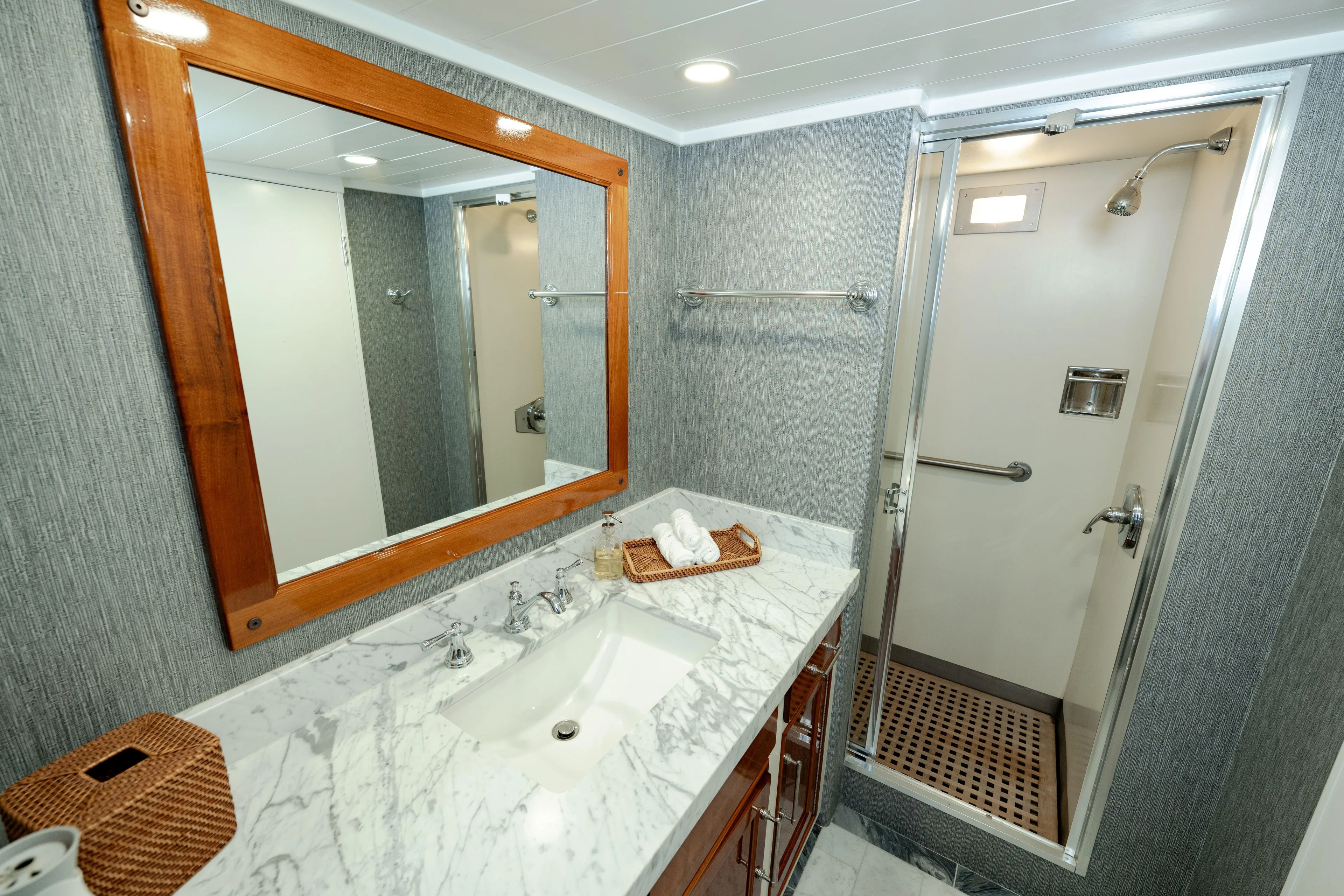 Nordic Star Yacht Photos Pics Luxurious 1969 Lantana Custom bathroom with marble countertop and modern shower.