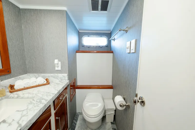 Nordic Star Yacht Photos Pics Luxurious 1969 Lantana Custom yacht bathroom with marble countertop and modern fixtures.