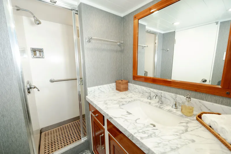 Nordic Star Yacht Photos Pics Luxurious 1969 Lantana Custom yacht bathroom with marble countertop and spacious shower.