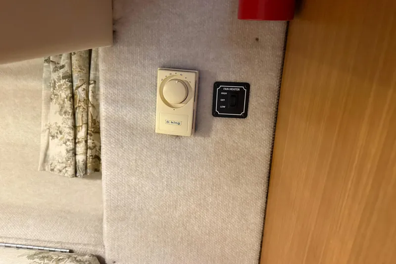 Touchdown Yacht Photos Pics Thermostat and fan heater controls on 2000 Bayliner 3988 Command Bridge Motoryacht interior.