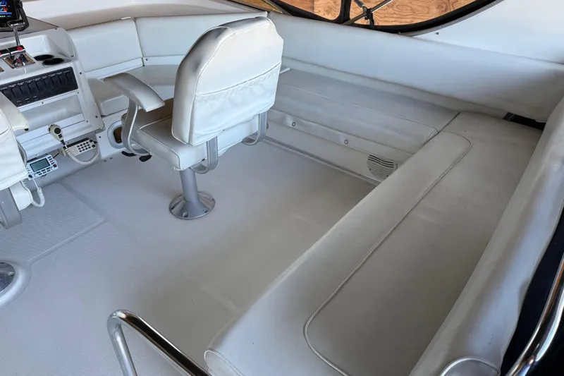 Touchdown Yacht Photos Pics 2000 Bayliner 3988 Command Bridge Motoryacht interior with white seating and control panel.