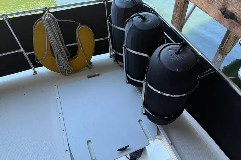 Touchdown Yacht Photos Pics Bayliner 3988 Command Bridge Motoryacht 2000 deck with fenders and life preserver.