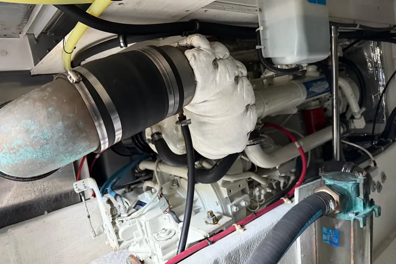 Touchdown Yacht Photos Pics Engine room of 2000 Bayliner 3988 Command Bridge Motoryacht, showcasing mechanical components.