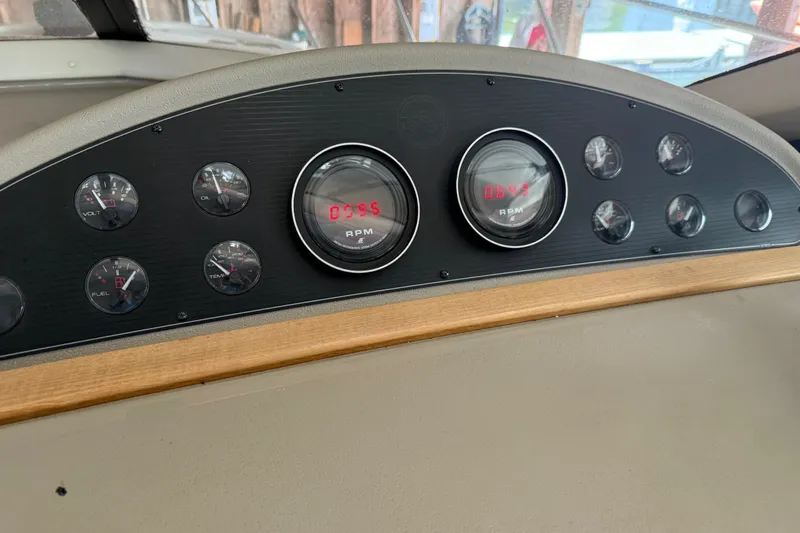 Touchdown Yacht Photos Pics Dashboard of 2000 Bayliner 3988 Command Bridge Motoryacht with gauges and RPM display.