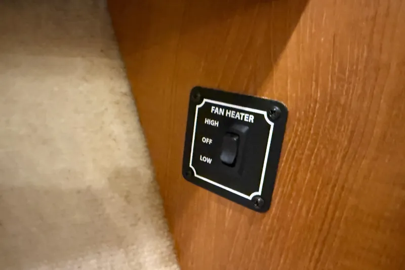 Touchdown Yacht Photos Pics Fan heater control panel on 2000 Bayliner 3988 Command Bridge Motoryacht, featuring high, off, and low settings.